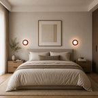 Pair of Mini Glass Orb Nordic Wall Lights in red used as bedside lights in a minimal Nordic bedroom