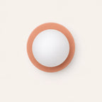 Mini Glass Orb Nordic Wall Light in pink, front-facing view showing circular disc and frosted glass orb