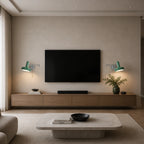 Pair of green pull cord swing arm retro wall lights flanking a wall-mounted TV in a modern living room
