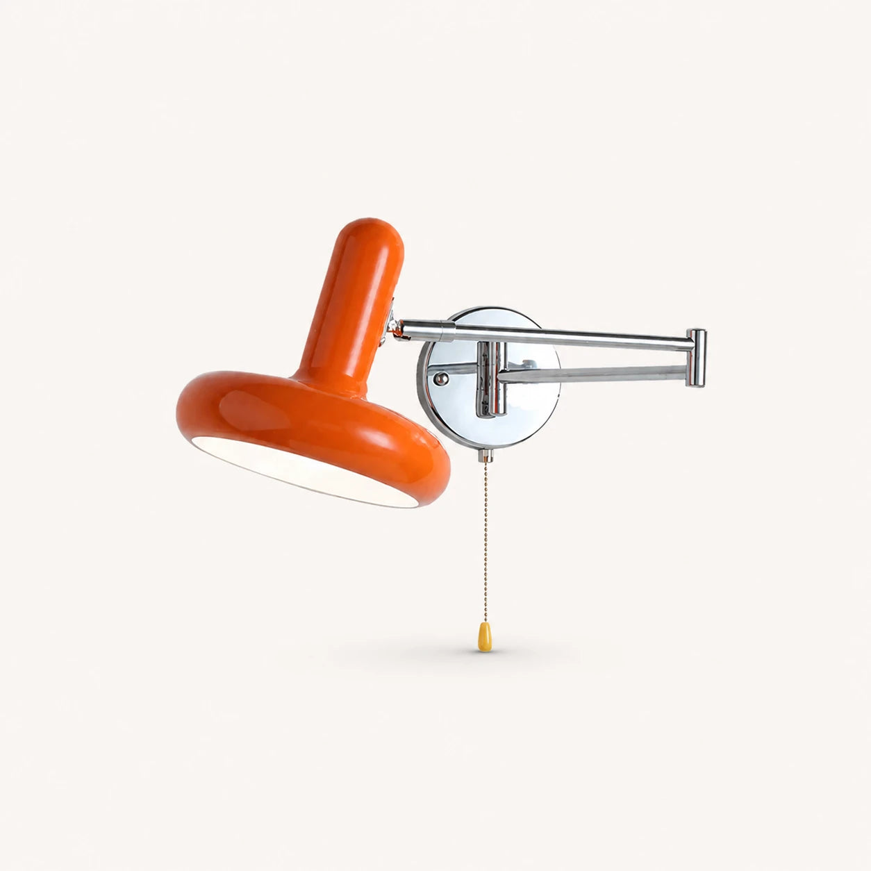 Pull cord swing arm retro wall light in orange with pull cord — warm retro accent for eclectic bedrooms.