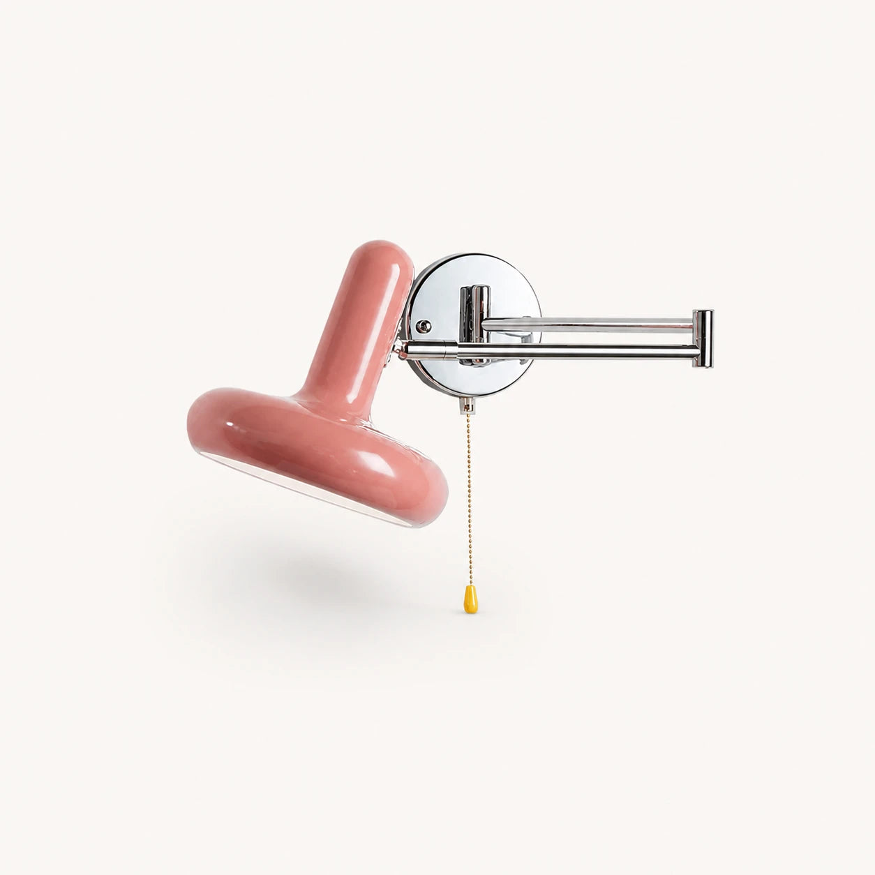 Pull cord swing arm retro wall light in pink with pull cord — soft pastel accent for bedroom walls.