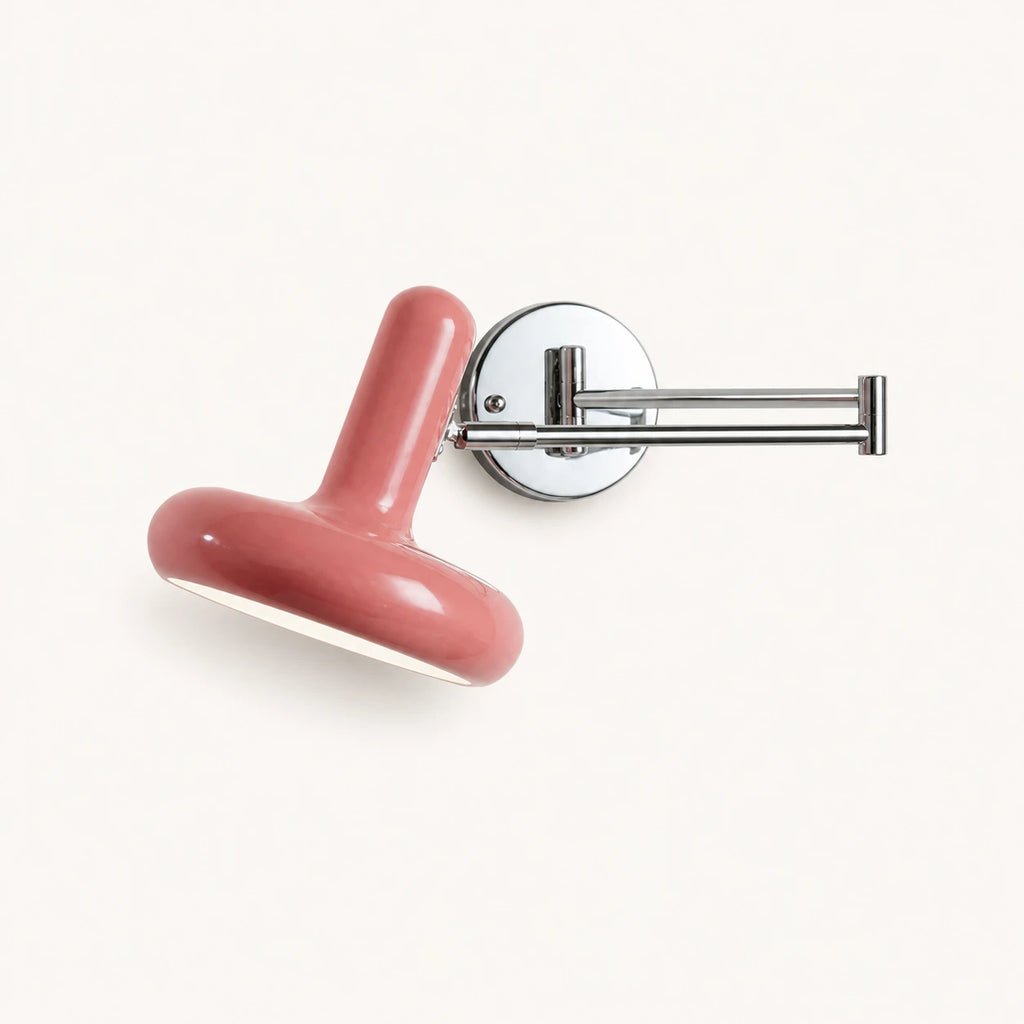 Pull cord swing arm retro wall light in pink with wall switch — soft feminine tone for vintage-style bedrooms.