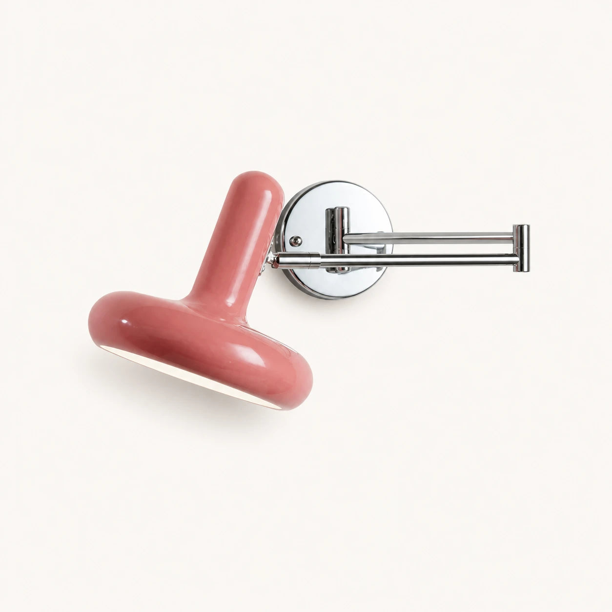 Pull cord swing arm retro wall light in pink with wall switch — soft feminine tone for vintage-style bedrooms.