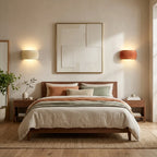 Pair of ribbed resin Nordic wall lights in cream and terracotta as bedside sconces in a natural earthy bedroom.