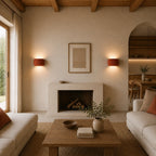 Ribbed resin Nordic wall light in a reading nook, providing hotel-style ambient lighting for bedside reading.