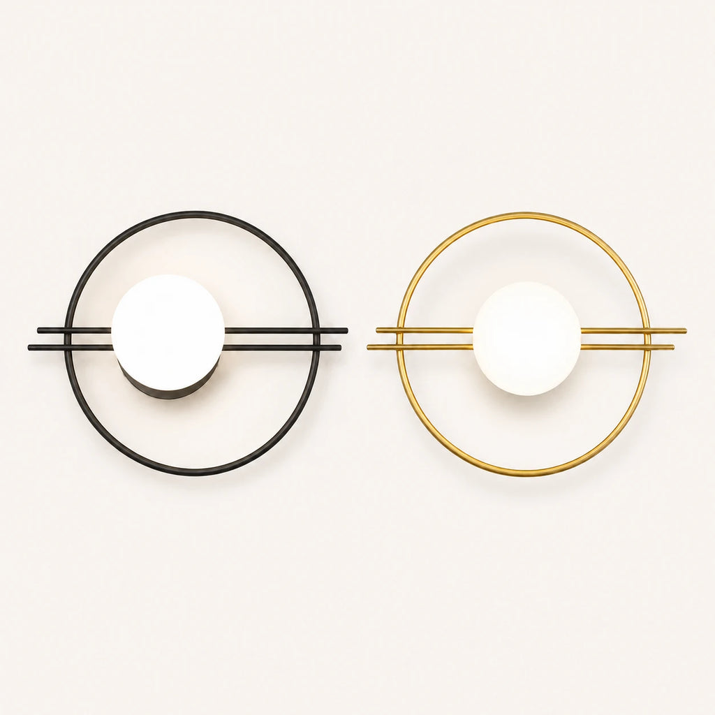 Ring frame globe LED modern wall sconce shown in black and gold finish options with white opal globe shade