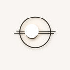 Black ring frame globe LED modern wall sconce with matte black circular ring frame and white opal globe detail
