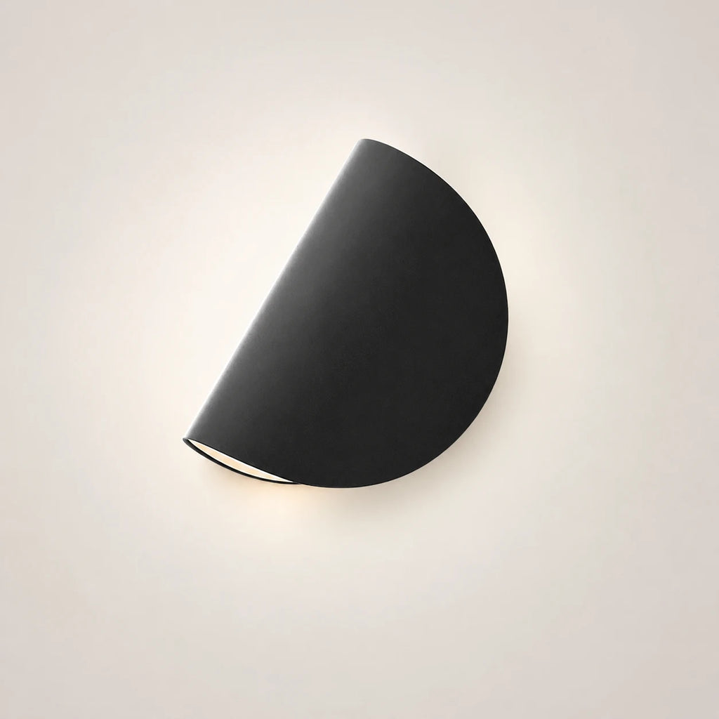 Rotating half-disc LED modern wall light in black — bold minimal semicircular panel for statement walls and feature lighting.