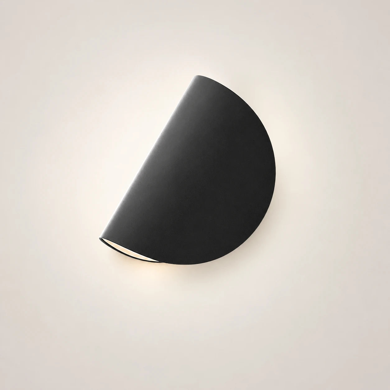 Rotating half-disc LED modern wall light in black — bold minimal semicircular panel for statement walls and feature lighting.
