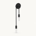 Twin arm candle modern wall sconce black left-facing variant with matte black arms and dual tubular shades