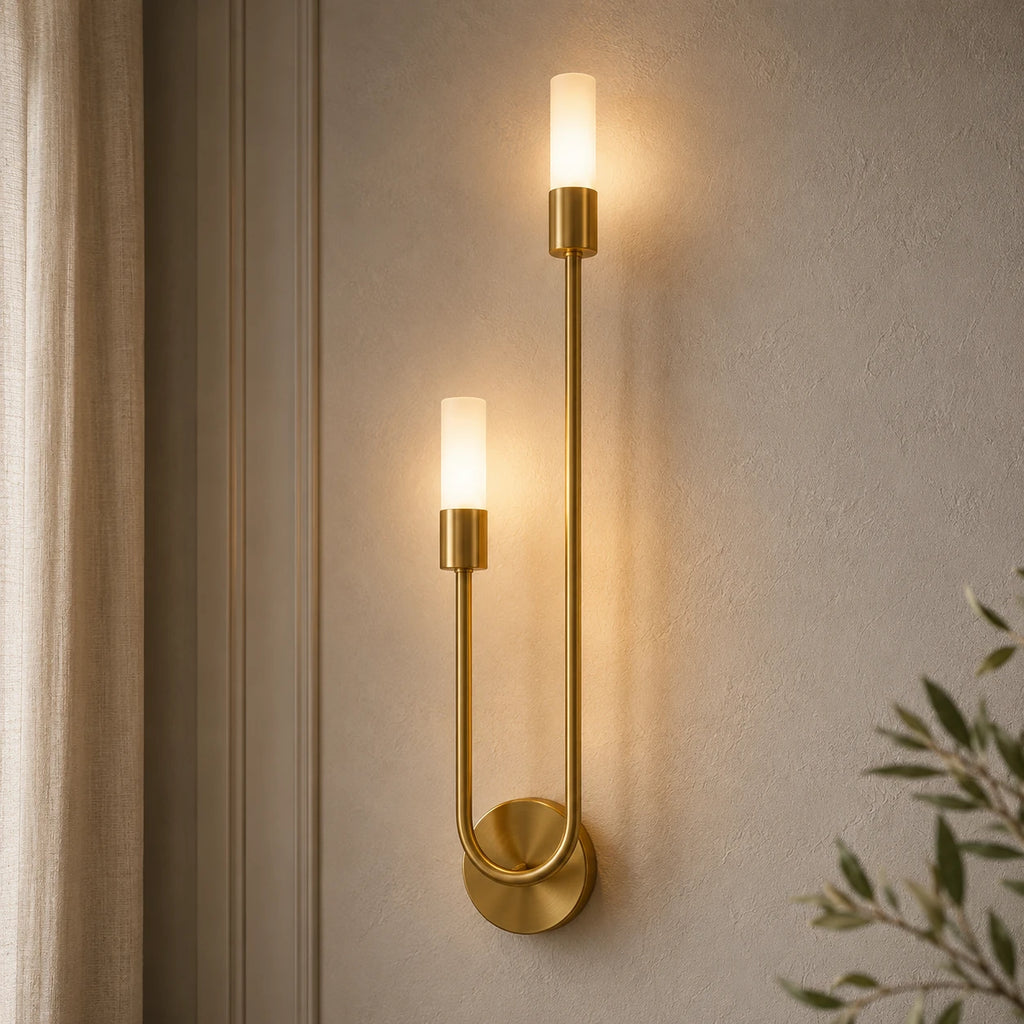 Twin arm candle modern wall sconce with brushed gold arms and dual tubular opal shades hero product shot