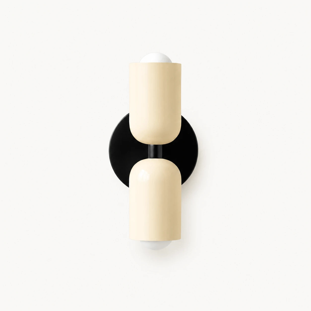 Two-tone Nordic indoor wall light — cream cylindrical shades on a black backplate for a monochrome contemporary Scandinavian finish.