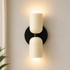 Two-tone Nordic indoor wall light — cream and black cylindrical shades.