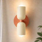 Two-tone Nordic indoor wall light — cream and pink cylindrical shades.