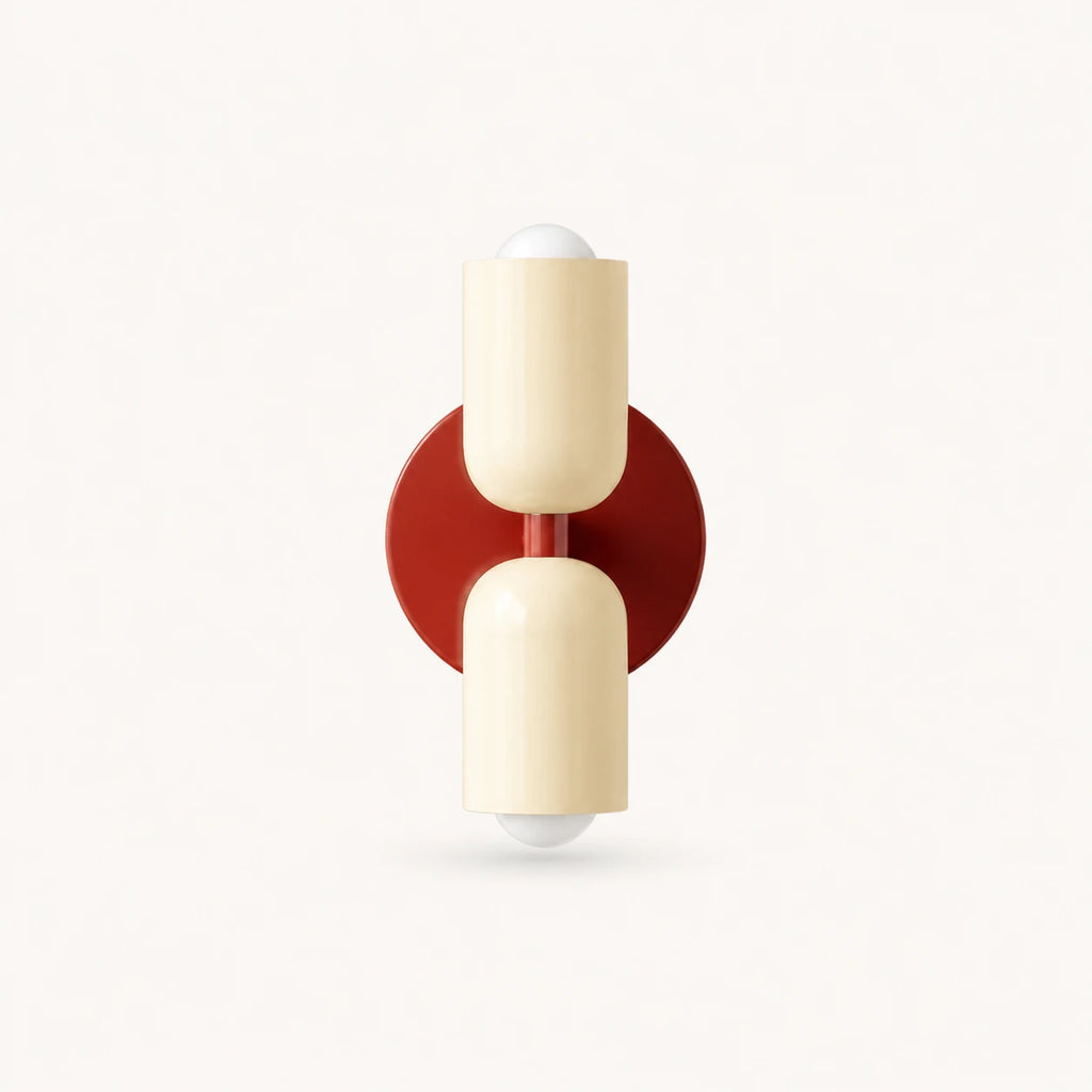 Two-tone Nordic indoor wall light — cream shades on a red backplate for a warm Scandinavian accent colour.