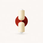 Two-tone Nordic indoor wall light — cream shades on a red backplate for a warm Scandinavian accent colour.