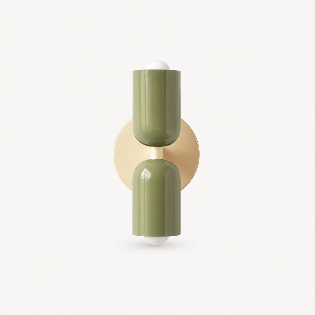 Two-tone Nordic indoor wall light — olive green cylindrical shades on a cream backplate for earthy biophilic Nordic interiors.