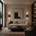 Pair of red and black two-tone Nordic up and down wall lights casting warm ambient glow in a modern living room.