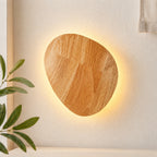 Wooden backlit LED Japandi wall light — oval shape.